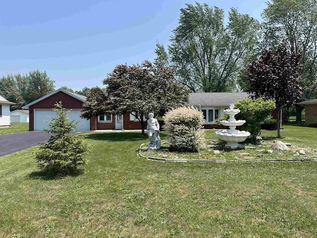 13405 S Gera Rd, Birch Run, MI 48415 - obstructed view of property featuring a front lawn, asphalt driveway, and brick siding