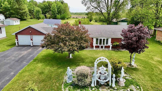 13405 S Gera Rd, Birch Run, MI 48415 - view of front of home with driveway, a front yard, a shingled roof, and a garage