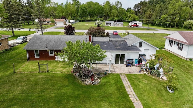 13405 S Gera Rd, Birch Run, MI 48415 - rear view of house with a patio and a chimney