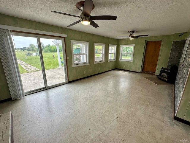 13405 S Gera Rd, Birch Run, MI 48415 - unfurnished living room featuring ceiling fan and a textured ceiling