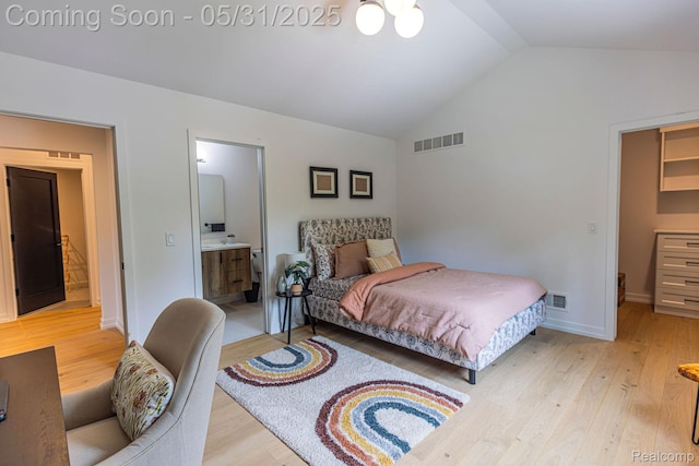 923 S Glenhurst Dr, Birmingham, MI 48009 - bedroom with vaulted ceiling, light wood-style floors, connected bathroom, and baseboards