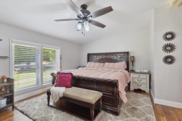 5885 Lammers Rd, Hastings, MI 49058 - bedroom with baseboards, wood finished floors, a ceiling fan, and lofted ceiling