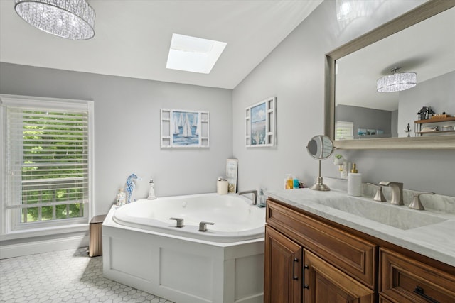 5885 Lammers Rd, Hastings, MI 49058 - bathroom featuring a skylight, vanity, and a garden tub