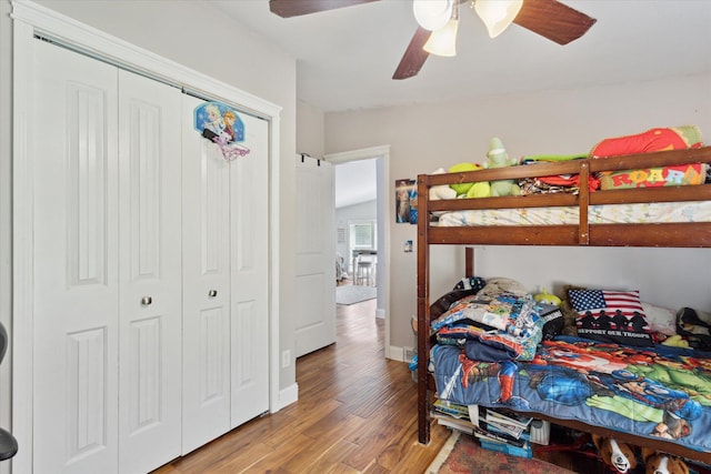 5885 Lammers Rd, Hastings, MI 49058 - bedroom featuring wood finished floors, a closet, ceiling fan, and baseboards