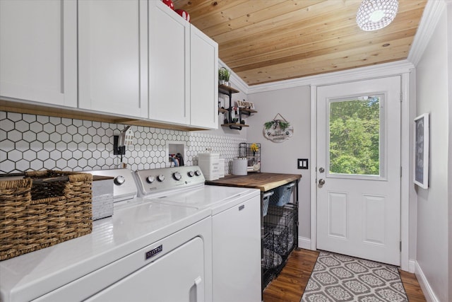 5885 Lammers Rd, Hastings, MI 49058 - laundry area featuring cabinet space, wood ceiling, washer and clothes dryer, dark wood-type flooring, and baseboards