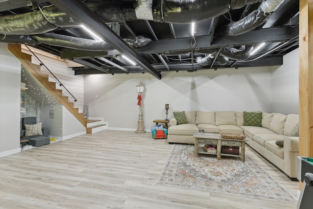 5885 Lammers Rd, Hastings, MI 49058 - living room featuring wood finished floors, baseboards, and stairway