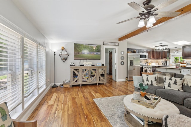 5885 Lammers Rd, Hastings, MI 49058 - living area featuring light wood-type flooring, ceiling fan, and baseboards