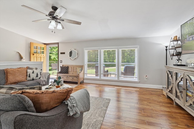 5885 Lammers Rd, Hastings, MI 49058 - living area with light wood-style floors, a ceiling fan, and baseboards