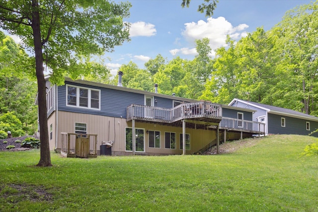 5885 Lammers Rd, Hastings, MI 49058 - back of house with a deck, a lawn, and central AC