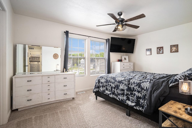 10900 Vine Leaf Cir, Allendale, MI 49401 - bedroom featuring light carpet, baseboards, and a ceiling fan