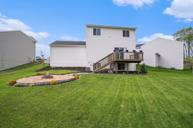 10900 Vine Leaf Cir, Allendale, MI 49401 - back of house featuring a wooden deck, stairway, an outdoor fire pit, and a yard