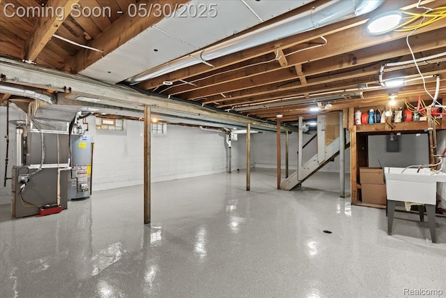 114 N Connecticut Ave, Royal Oak, MI 48067 - basement featuring gas water heater, heating unit, stairway, and a sink