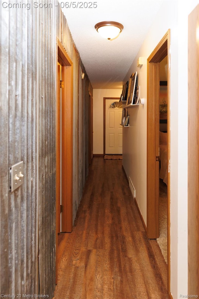 4447 Stanley Rd, Genesee, MI 48437 - corridor with dark wood-style floors and baseboards