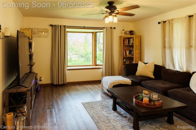 4447 Stanley Rd, Genesee, MI 48437 - living room featuring a ceiling fan, wood finished floors, and baseboards