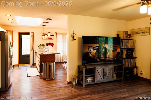 4447 Stanley Rd, Genesee, MI 48437 - living area with a skylight, wood finished floors, ceiling fan, and recessed lighting