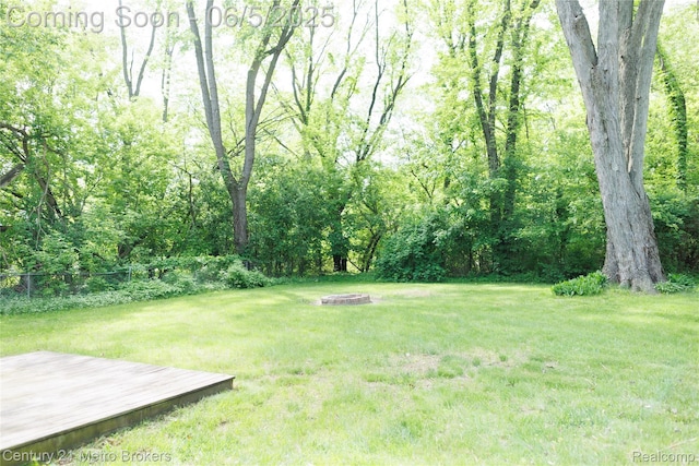 4447 Stanley Rd, Genesee, MI 48437 - view of yard with a fire pit and a wooden deck