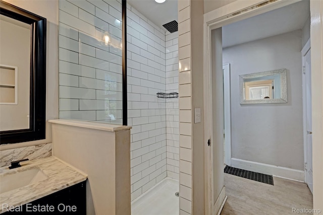86 Marquette St, Pontiac, MI 48342 - bathroom featuring a walk in shower, vanity, baseboards, and wood finished floors