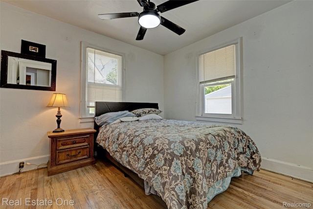 86 Marquette St, Pontiac, MI 48342 - bedroom with multiple windows, wood finished floors, and baseboards