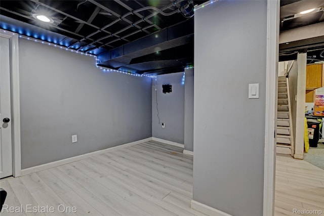 86 Marquette St, Pontiac, MI 48342 - finished below grade area with wood finished floors, baseboards, and stairway
