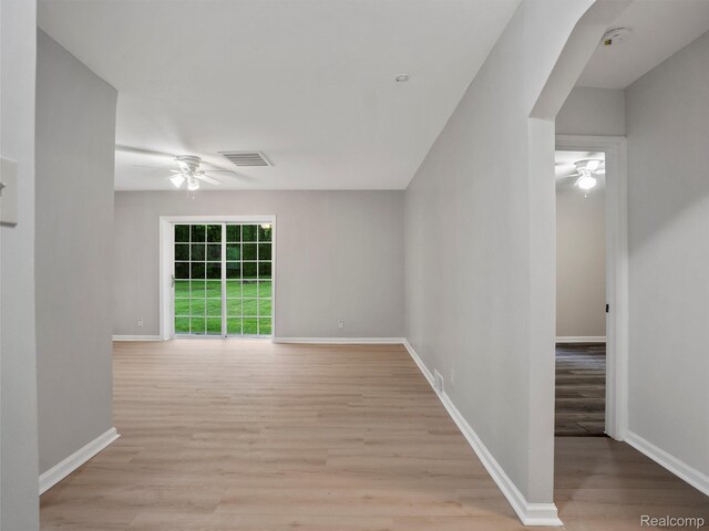 5220 County Line Rd, Lenox, MI 48048 - empty room with a ceiling fan, light wood finished floors, and baseboards