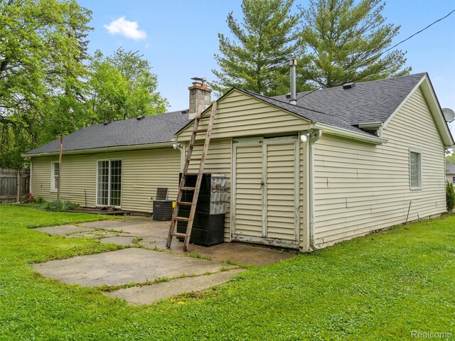 5220 County Line Rd, Lenox, MI 48048 - rear view of house with a chimney, a patio, a shingled roof, and central air condition unit