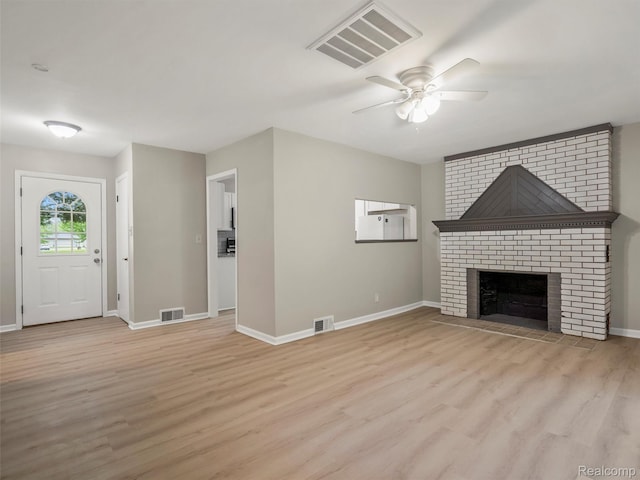 5220 County Line Rd, Lenox, MI 48048 - unfurnished living room featuring ceiling fan, light wood-type flooring, and baseboards