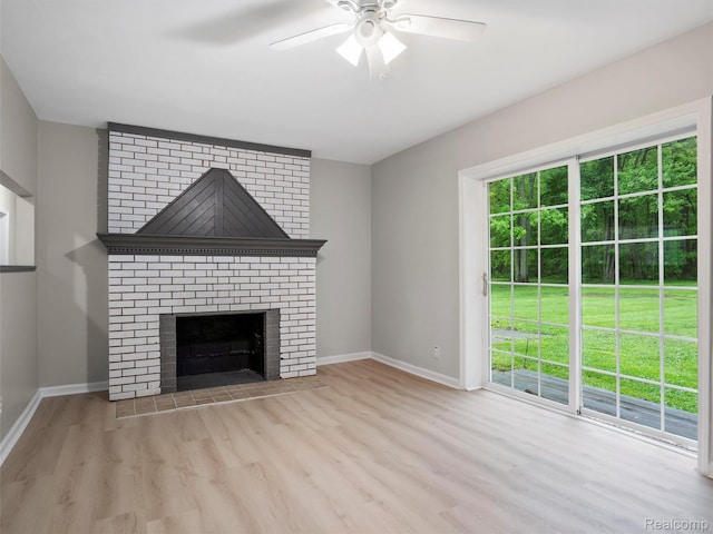 5220 County Line Rd, Lenox, MI 48048 - unfurnished living room with wood finished floors, plenty of natural light, a ceiling fan, and baseboards