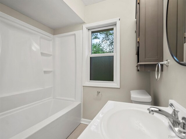 5220 County Line Rd, Lenox, MI 48048 - full bathroom with a sink, baseboards, and tub / shower combination