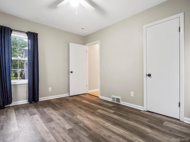 5220 County Line Rd, Lenox, MI 48048 - unfurnished bedroom featuring wood finished floors, baseboards, and ceiling fan