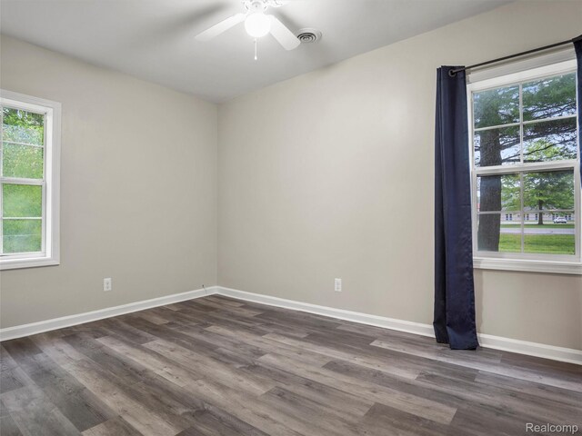 5220 County Line Rd, Lenox, MI 48048 - unfurnished room featuring baseboards, a ceiling fan, and dark wood-style floors