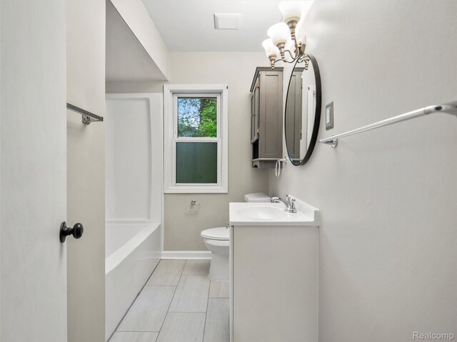 5220 County Line Rd, Lenox, MI 48048 - full bathroom featuring toilet, vanity, a chandelier, and baseboards