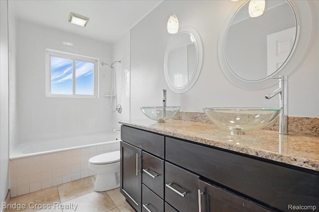 23850 Barfield St, Farmington, MI 48336 - bathroom with double vanity, tiled shower / bath, toilet, and tile patterned flooring