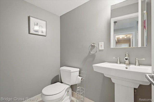 23850 Barfield St, Farmington, MI 48336 - half bath with baseboards, toilet, and a sink