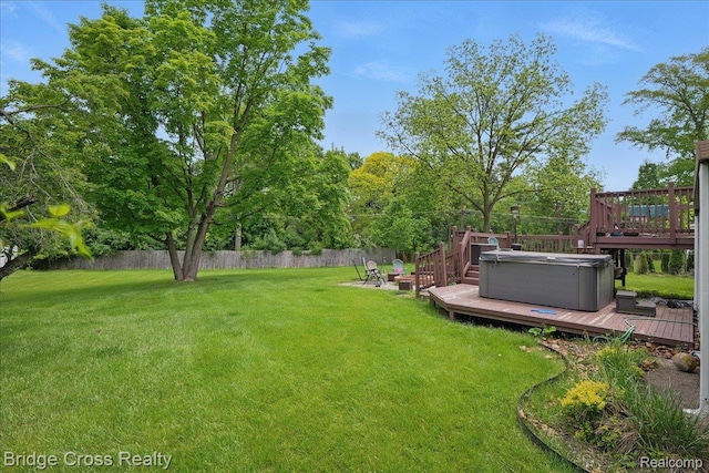 23850 Barfield St, Farmington, MI 48336 - view of yard featuring a deck, a hot tub, and an outdoor fire pit