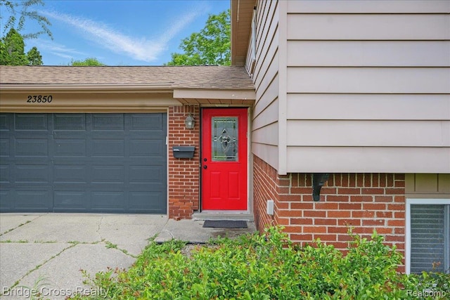 23850 Barfield St, Farmington, MI 48336 - doorway to property with brick siding