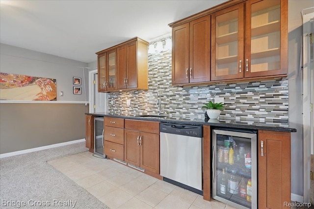 23850 Barfield St, Farmington, MI 48336 - kitchen featuring dishwasher, beverage cooler, a sink, dark countertops, and brown cabinets