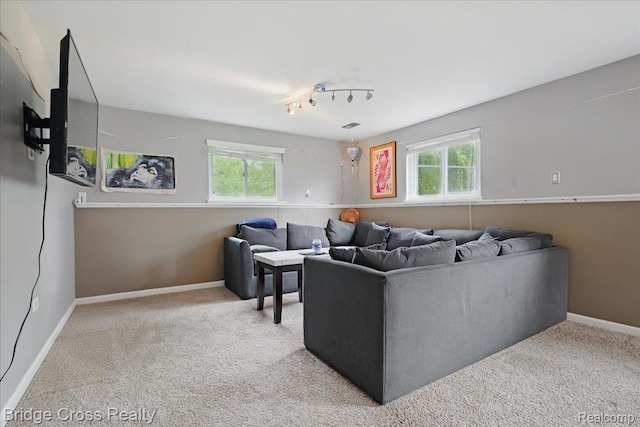 23850 Barfield St, Farmington, MI 48336 - carpeted living room featuring healthy amount of natural light and baseboards