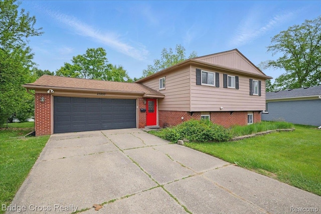 23850 Barfield St, Farmington, MI 48336 - tri-level home with a front yard, a garage, concrete driveway, and brick siding