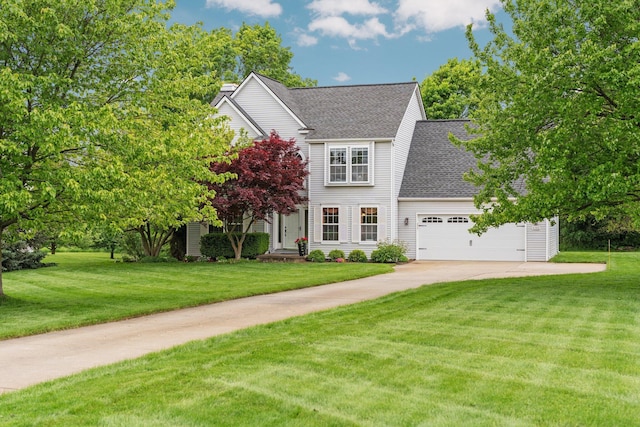 4388 Lori Lynn Ln, Whitmore Lake, MI 48189 - view of front facade featuring a shingled roof, a front yard, driveway, and a garage