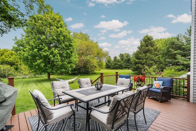 4388 Lori Lynn Ln, Whitmore Lake, MI 48189 - wooden deck with outdoor dining area, a lawn, view of wooded area, and an outdoor living space