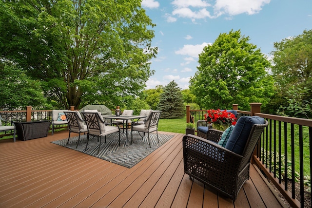 4388 Lori Lynn Ln, Whitmore Lake, MI 48189 - wooden terrace featuring outdoor dining area, an outdoor hangout area, a lawn, and view of scattered trees