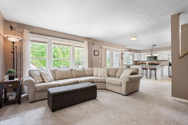 4388 Lori Lynn Ln, Whitmore Lake, MI 48189 - living room featuring light carpet, a textured ceiling, and baseboards