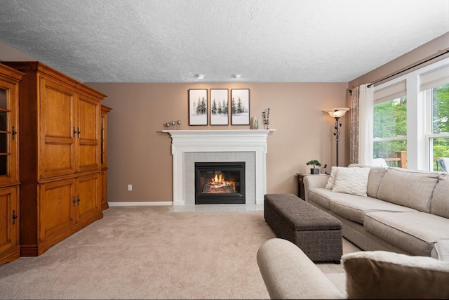 4388 Lori Lynn Ln, Whitmore Lake, MI 48189 - living room featuring a tile fireplace, light carpet, a textured ceiling, baseboards, and recessed lighting