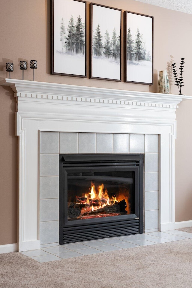 4388 Lori Lynn Ln, Whitmore Lake, MI 48189 - detailed view of a tiled fireplace and baseboards