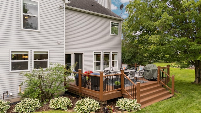 4388 Lori Lynn Ln, Whitmore Lake, MI 48189 - back of property with a lawn, a deck, a chimney, outdoor dining space, and roof with shingles