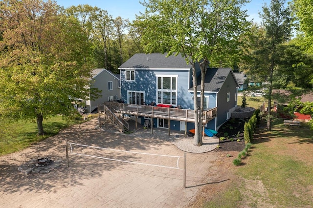 8106 Shenandoah Ln, Howard City, MI 49329 - back of house featuring a deck and stairway
