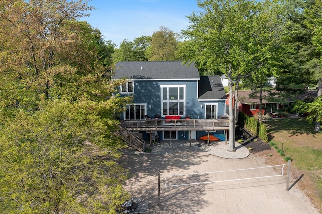 8106 Shenandoah Ln, Howard City, MI 49329 - rear view of house featuring a deck and a shingled roof
