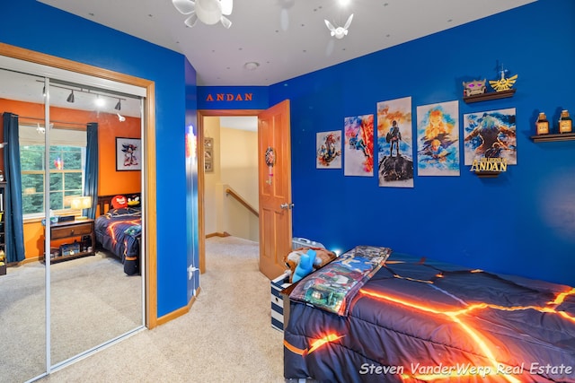 2567 Chippewa Trl, Muskegon, MI 49445 - carpeted bedroom featuring a closet and rail lighting