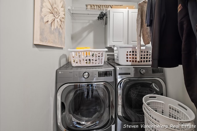 2567 Chippewa Trl, Muskegon, MI 49445 - washroom featuring cabinet space and washer and dryer