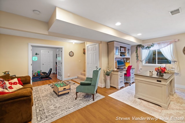 2567 Chippewa Trl, Muskegon, MI 49445 - living room with light wood-style floors, baseboards, stairs, and recessed lighting